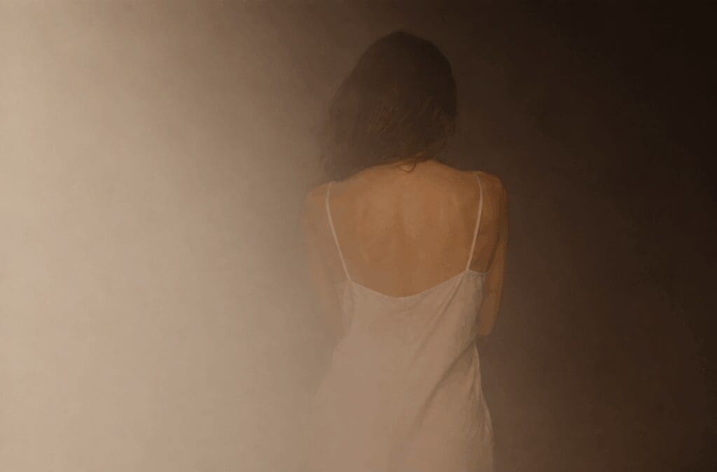 Woman seen from behind in soft light